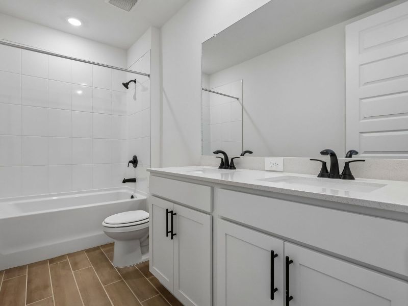 Furnished interior view inside a new home in The Grove at Stuart Crossing - Signature Series, Bartow (Image 6).