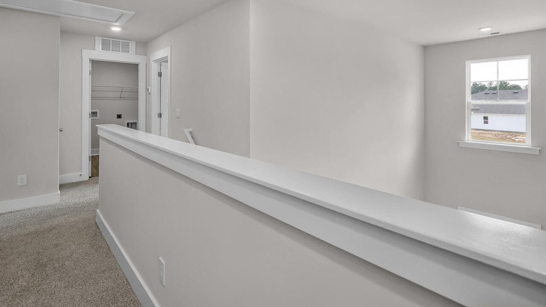 Spacious, unfurnished interior of a new home in The Haven at Indigo Preserve, Leland (Image 25).