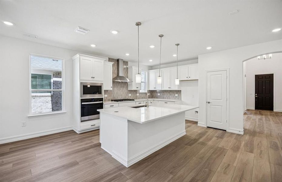 Kitchen featuring a large island ideal for informal dining and gatherings Kitchen featuring a large island ideal for informal dining and gatherings