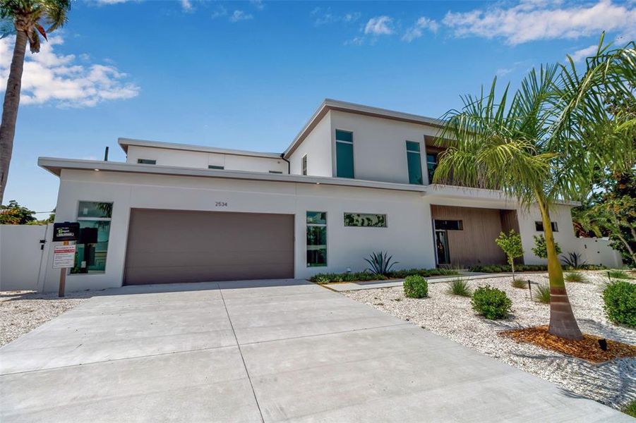 Front exterior of a new home in , Sarasota, FL, highlighting curb appeal (Image 30).