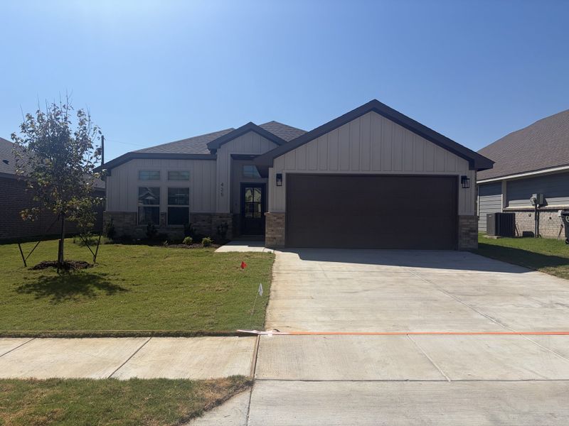Front exterior of a new home in Craftsman's Corner, Cleburne, TX, highlighting curb appeal (Image 2). Front exterior of a new home in Craftsman's Corner, Cleburne, TX, highlighting curb appeal (Image 2).