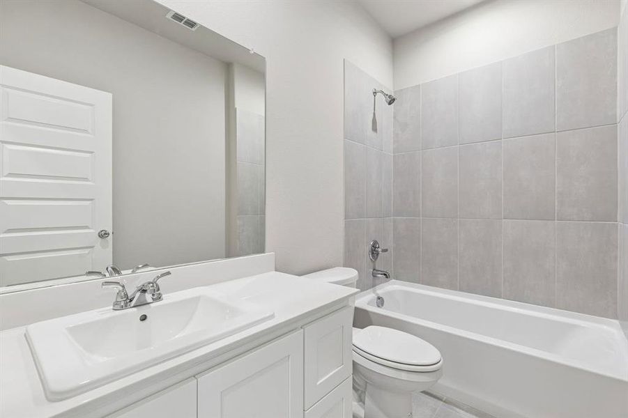 Bathroom in the Holden home plan by Trophy Signature Homes – REPRESENTATIVE PHOTO