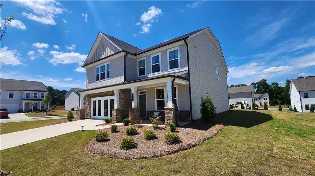 Front exterior of a new home in The Estates at Casteel, Bethlehem, GA, highlighting curb appeal (Image 24). Front exterior of a new home in The Estates at Casteel, Bethlehem, GA, highlighting curb appeal (Image 24).