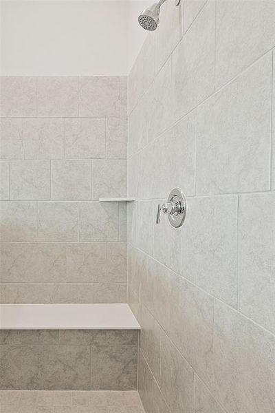 Bathroom featuring tiled shower