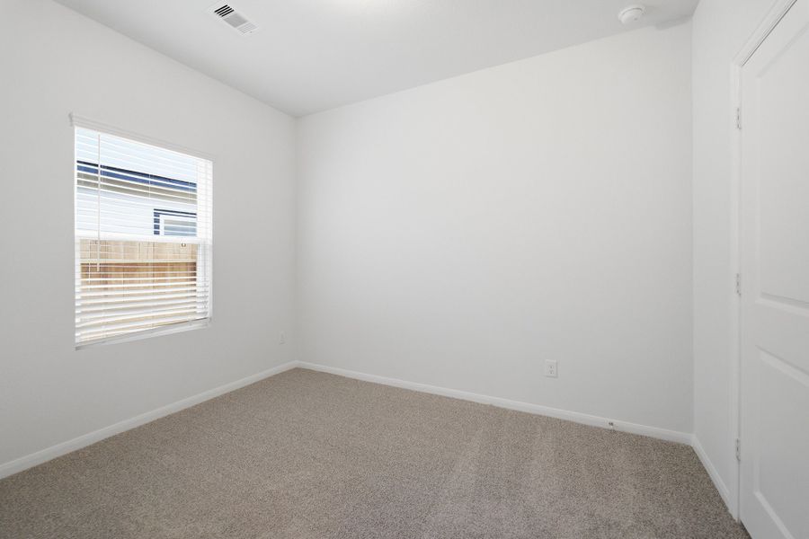 Spacious, unfurnished interior of a new home in The Pines at Seven Coves, Willis (Image 21).