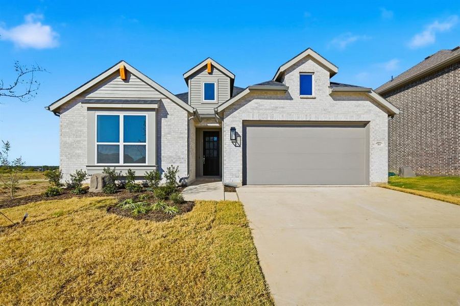 Front exterior of a new home in Heritage Ranch: 50ft. lots, Sherman, TX, highlighting curb appeal (Image 1).