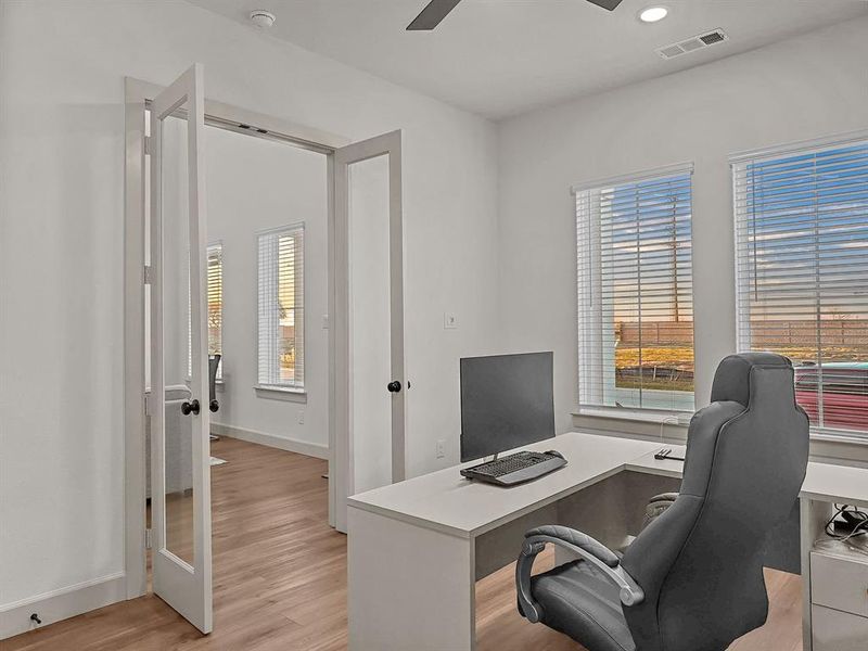 Office featuring light wood-type flooring, french doors, and ceiling fan