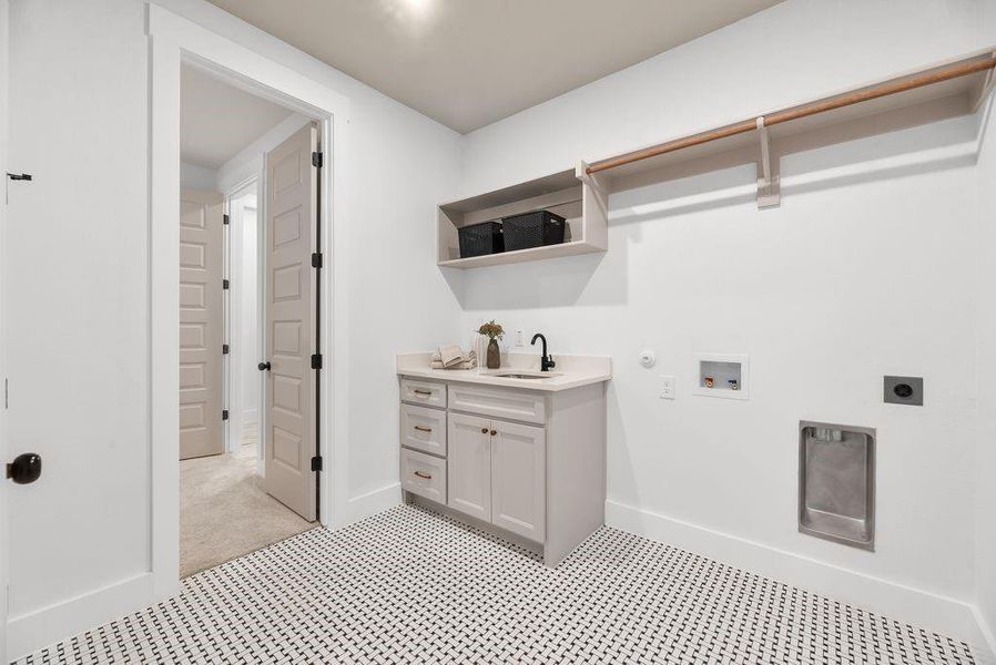 Laundry room featuring gas dryer hookup, hookup for a washing machine, and hookup for an electric dryer Laundry room featuring gas dryer hookup, hookup for a washing machine, and hookup for an electric dryer