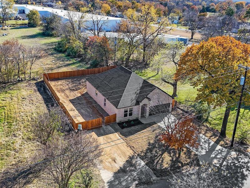 View from above of property featuring a tree filled landscape