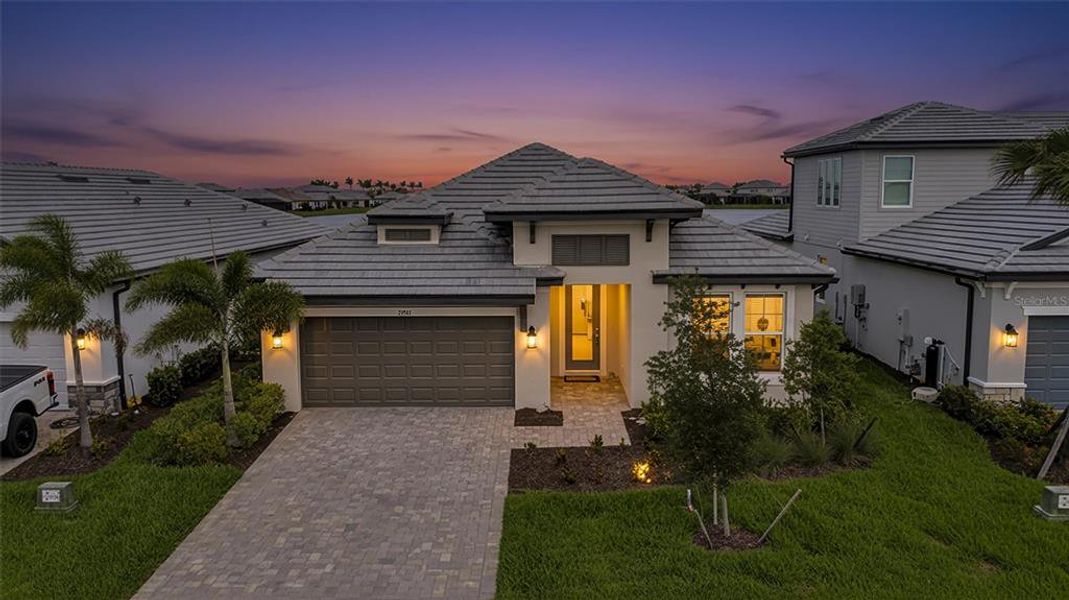 Front exterior of a new home in Sweetwater at Lakewood Ranch, Bradenton, FL, highlighting curb appeal (Image 1). Front exterior of a new home in Sweetwater at Lakewood Ranch, Bradenton, FL, highlighting curb appeal (Image 1).