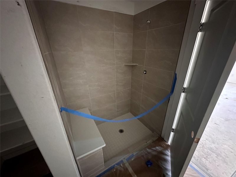 Full bathroom featuring a shower stall Full bathroom featuring a shower stall