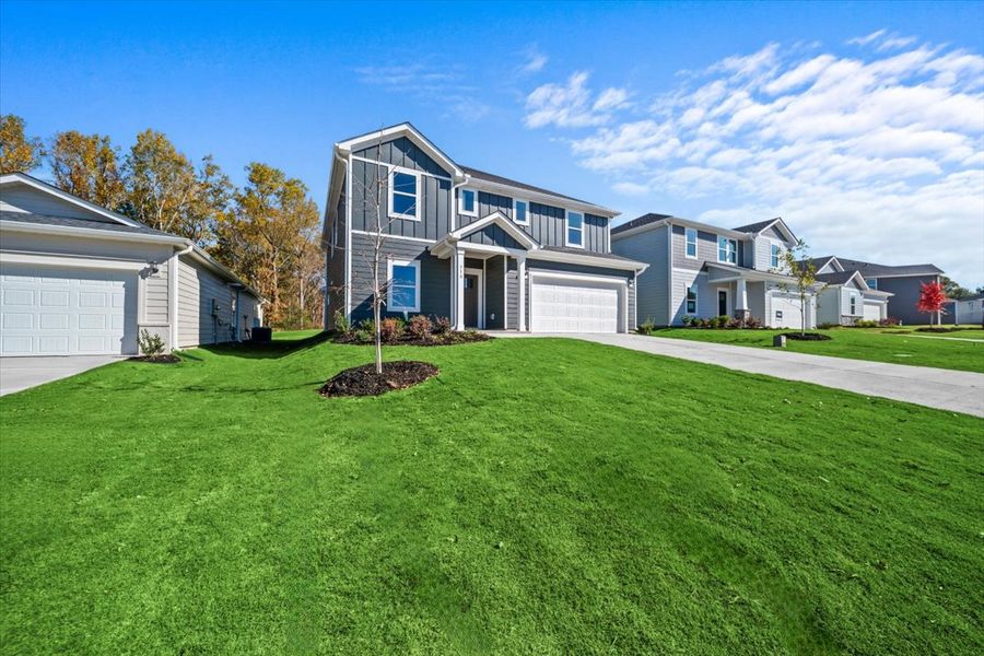 Front exterior of a new home in Riverwood Farm, Piedmont, SC, highlighting curb appeal (Image 2). Front exterior of a new home in Riverwood Farm, Piedmont, SC, highlighting curb appeal (Image 2).