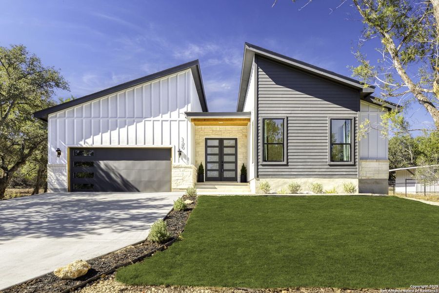 Front exterior of a new home in , Boerne, TX, highlighting curb appeal (Image 2).