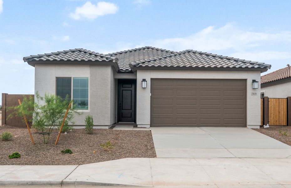Front exterior of a new home in Hayden Estates, Buckeye, AZ, highlighting curb appeal (Image 2). Front exterior of a new home in Hayden Estates, Buckeye, AZ, highlighting curb appeal (Image 2).