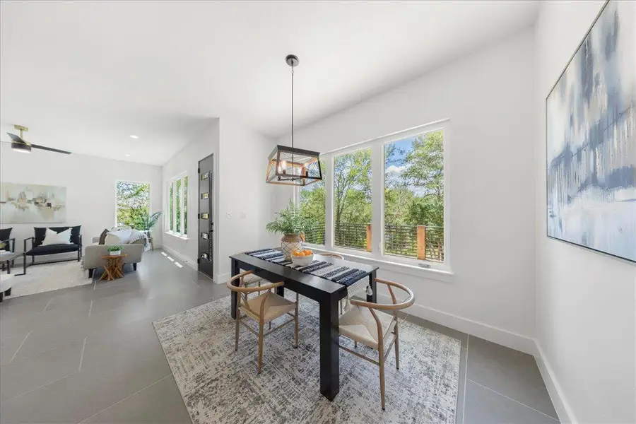 Tiled dining room featuring baseboards and recessed lighting Tiled dining room featuring baseboards and recessed lighting