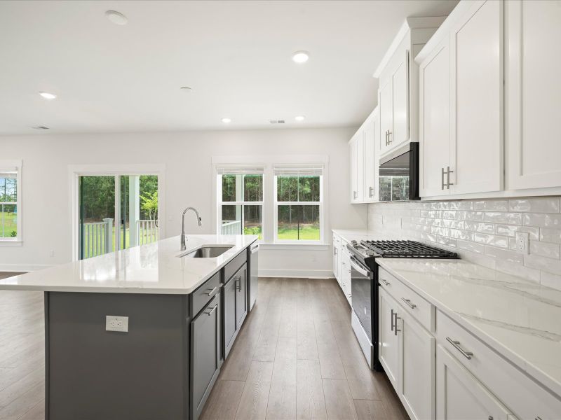 Furnished interior view inside a new home in The Coves at Lakes of Cane Bay, Summerville (Image 10).