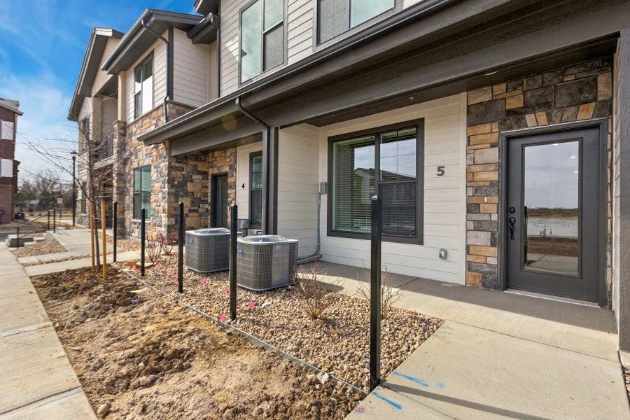 Exterior details and patio area of a home in Northfield at Old Town, Fort Collins (Image 2).