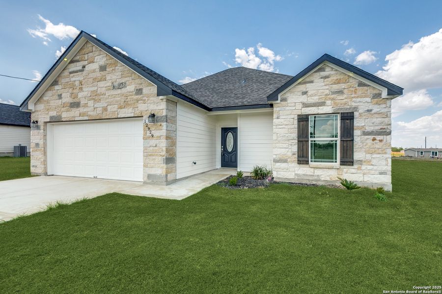 Front exterior of a new home in , Atascosa, TX, highlighting curb appeal (Image 1).
