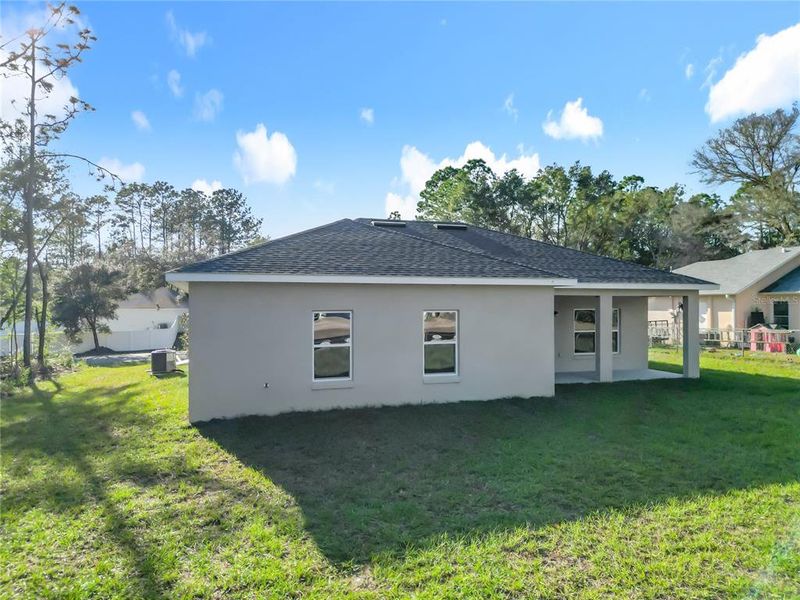 Exterior details and patio area of a home in , Citrus Springs (Image 4).