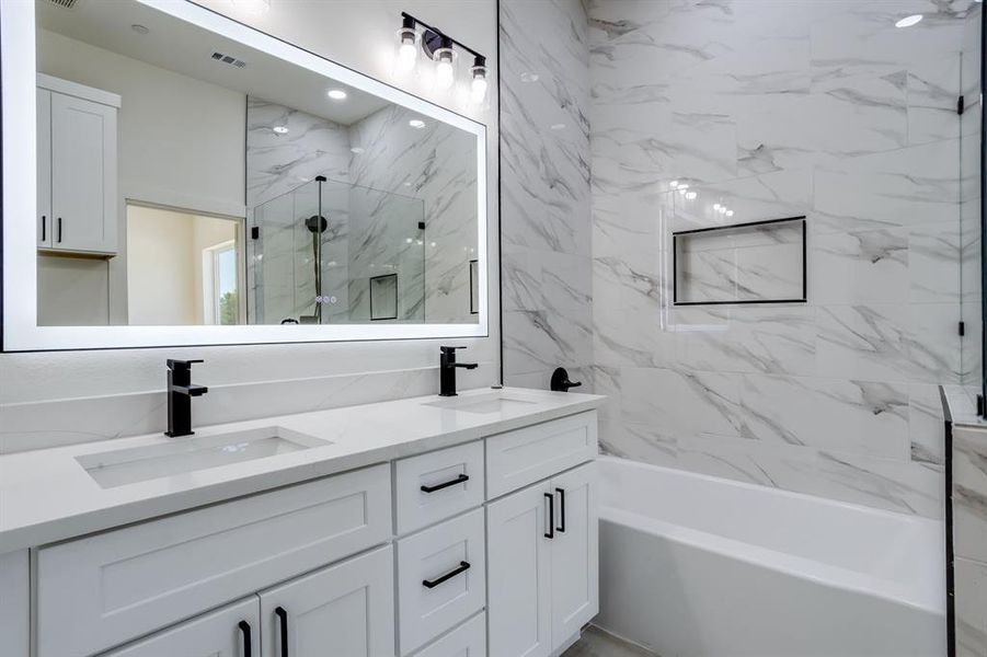 Bathroom featuring double vanity