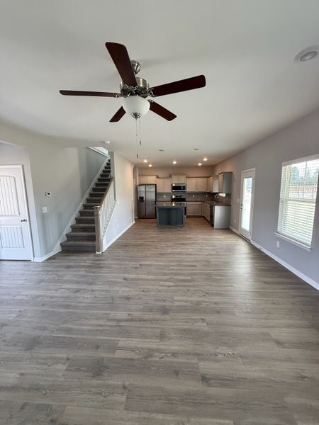 The first floor is open & spacious. This view is from the great room looking into the dining room & kitchen