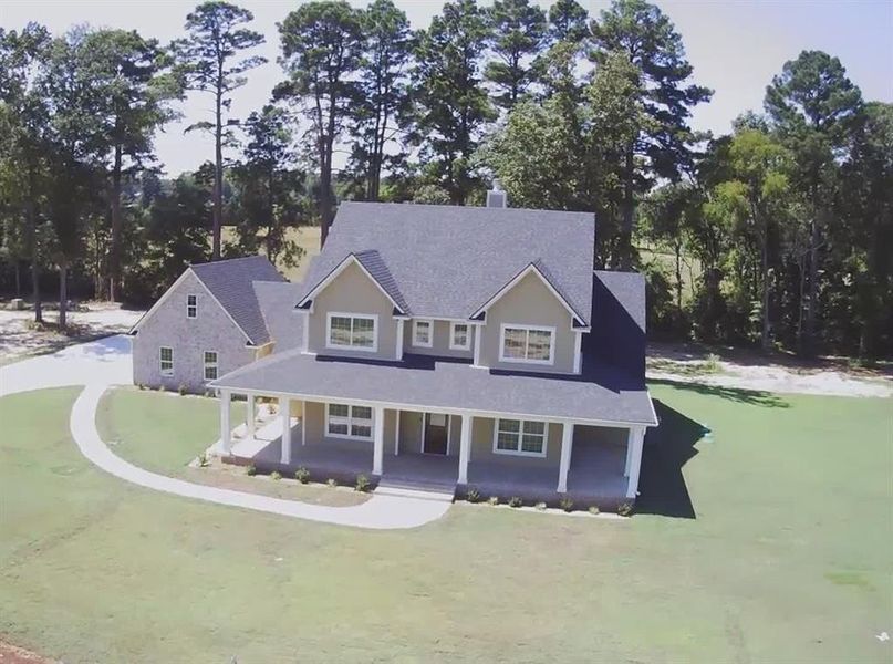 Front exterior of a new home in , Gilmer, TX, highlighting curb appeal (Image 2). Front exterior of a new home in , Gilmer, TX, highlighting curb appeal (Image 2).