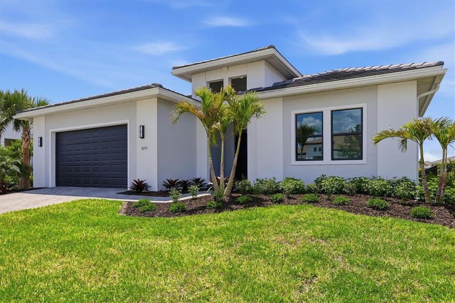 Front exterior of a new home in , Sarasota, FL, highlighting curb appeal (Image 25).