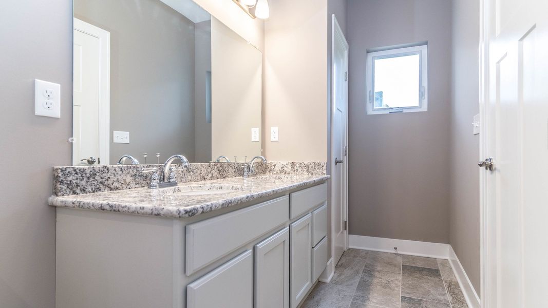 Representative furnished interior of a home built from the The Boulder Side Entry by Norfolk Homes in The Grande Estates, Jackson (Image 13).