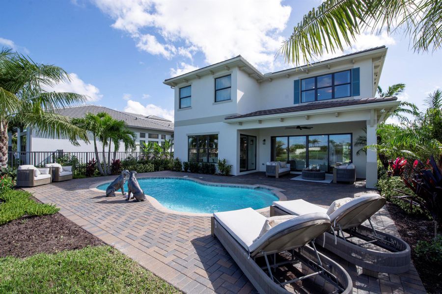 Front exterior of a new home in Apex at Avenir, Palm Beach Gardens, FL, highlighting curb appeal (Image 23).