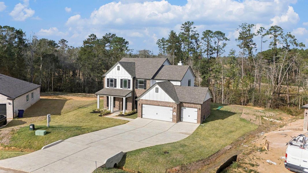 Front exterior of a new home in Oakwood Ranch, Willis, TX, highlighting curb appeal (Image 20).