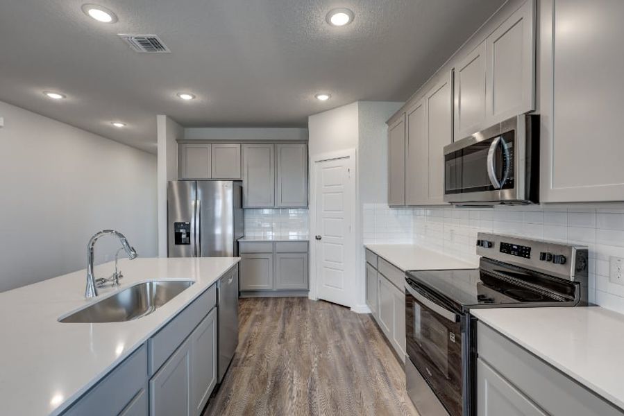 A kitchen with white cabinets. A kitchen with white cabinets.