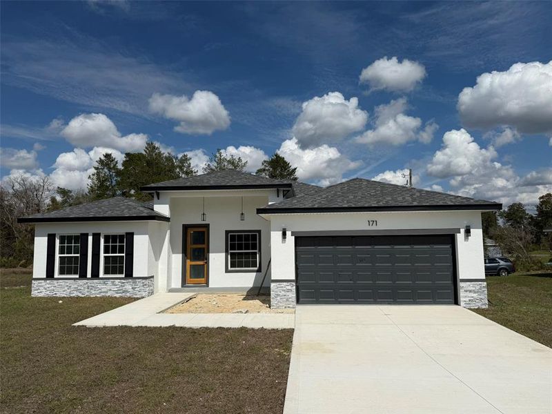 Front exterior of a new home in , Ocala, FL, highlighting curb appeal (Image 20).