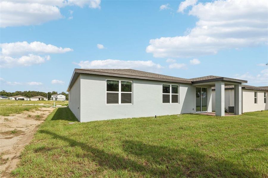 Exterior details and patio area of a home in Bradbury Creek - Signature Series, Haines City (Image 22).