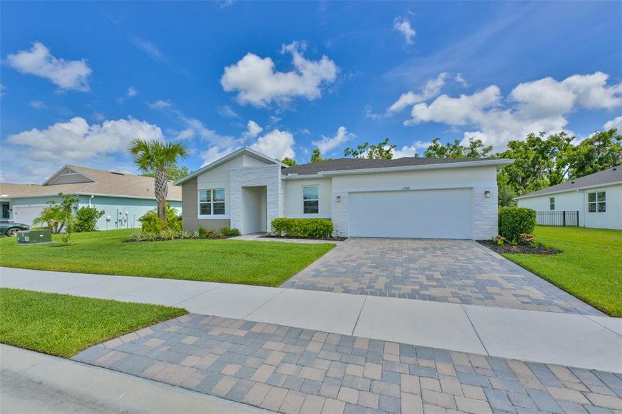 Front exterior of a new home in , Parrish, FL, highlighting curb appeal (Image 22).