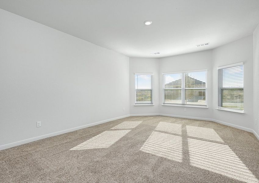 The master bedroom has three large windows that let in great, natural light.