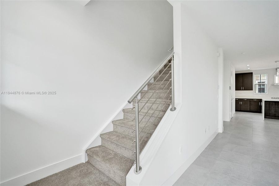 Second set of stairs to the third level