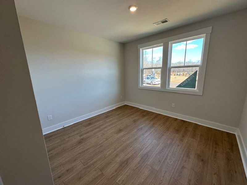 This spacious room offers abundant natural light a