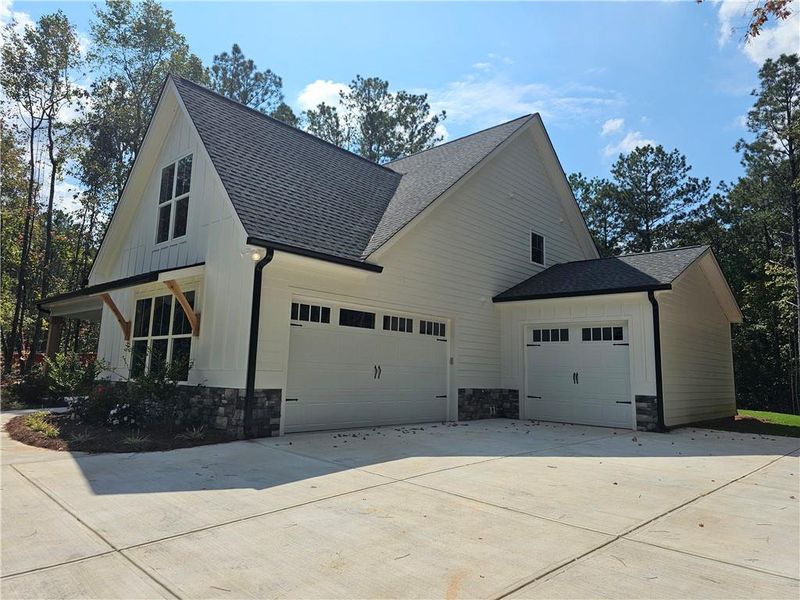 Front exterior of a new home in , Douglasville, GA, highlighting curb appeal (Image 24).