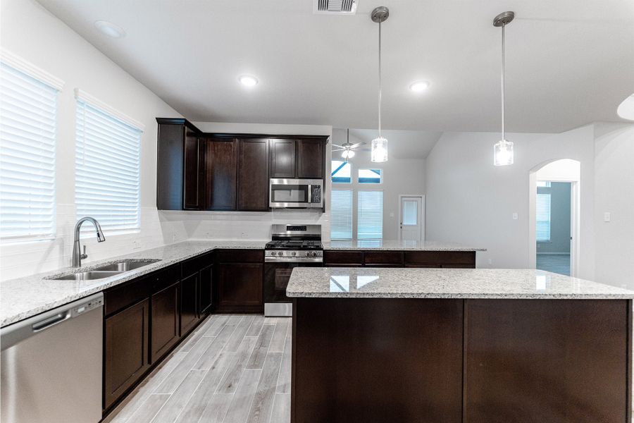 Furnished interior view inside a new home in Creekhaven, Iowa Colony (Image 4).