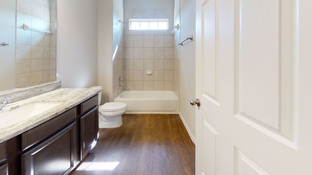 Representative furnished interior of a home built from the Floor Plan 3256 by Colina Homes in Grand Magnolia, Magnolia (Image 32).