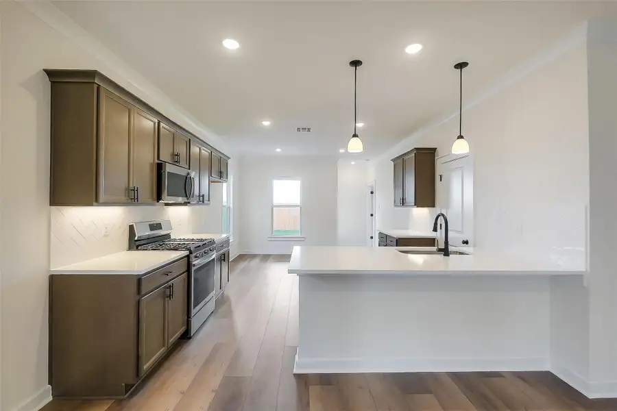 Furnished interior view inside a new home in Aldeana, Bonney (Image 5).