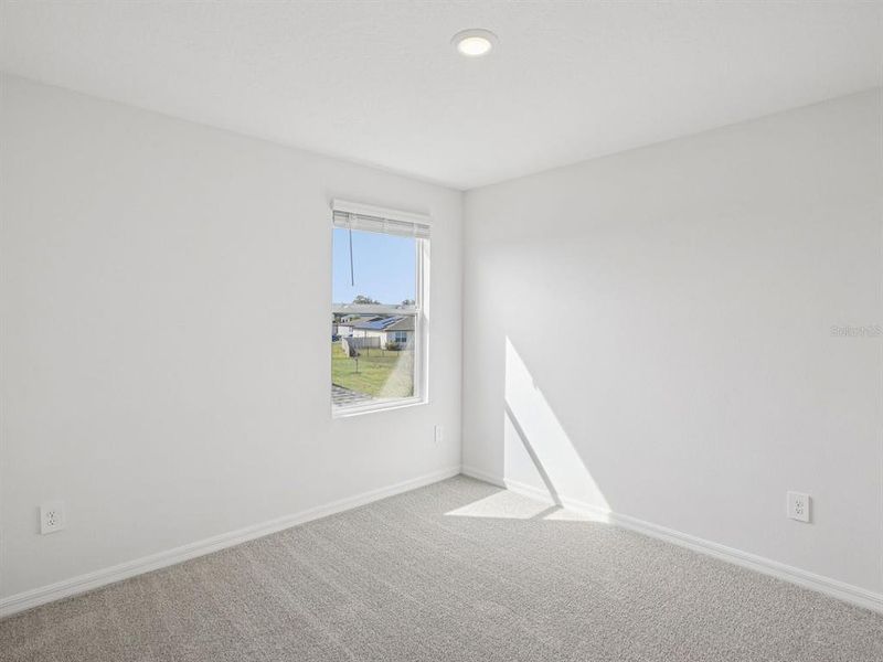 Spacious, unfurnished interior of a new home in The Grove at Stuart Crossing - Classic Series, Bartow (Image 36).