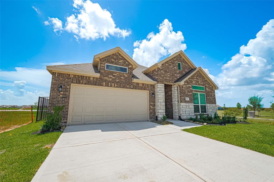 Front exterior of a new home in Lago Mar, Texas City, TX, highlighting curb appeal (Image 18). Front exterior of a new home in Lago Mar, Texas City, TX, highlighting curb appeal (Image 18).