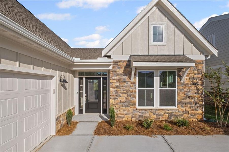 Front exterior of a new home in Laurel Farms, Dallas, GA, highlighting curb appeal (Image 23). Front exterior of a new home in Laurel Farms, Dallas, GA, highlighting curb appeal (Image 23).