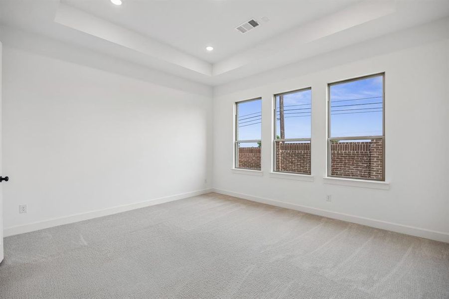 The light filled owner's suite is located at the back of the home for additional privacy.