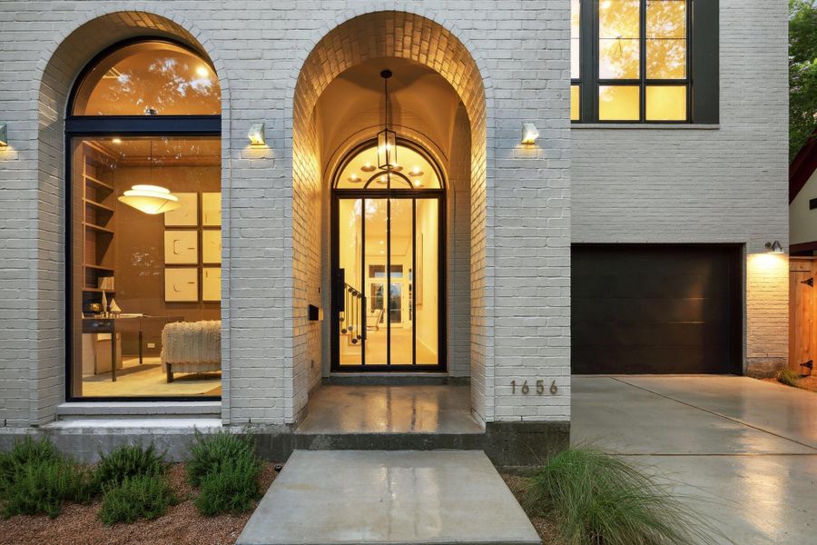 Covered Front Entrance with a Hanging Pendant Fixture. There is also Exterior Accent Lighting on the Front Elevation of the Home Covered Front Entrance with a Hanging Pendant Fixture. There is also Exterior Accent Lighting on the Front Elevation of the Home