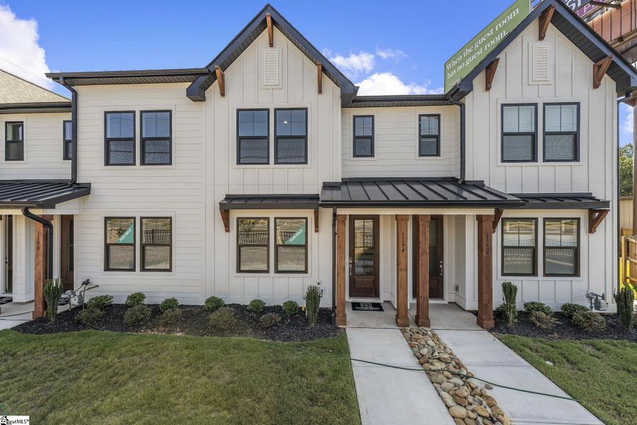 Front exterior of a new home in Renaissance Place, Greenville, SC, highlighting curb appeal (Image 1). Front exterior of a new home in Renaissance Place, Greenville, SC, highlighting curb appeal (Image 1).