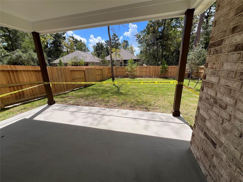 Exterior details and patio area of a home in The Woodlands Hills, Willis (Image 17).