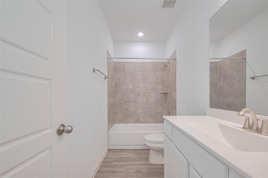 Furnished interior view inside a new home in Sunterra, Katy (Image 14).