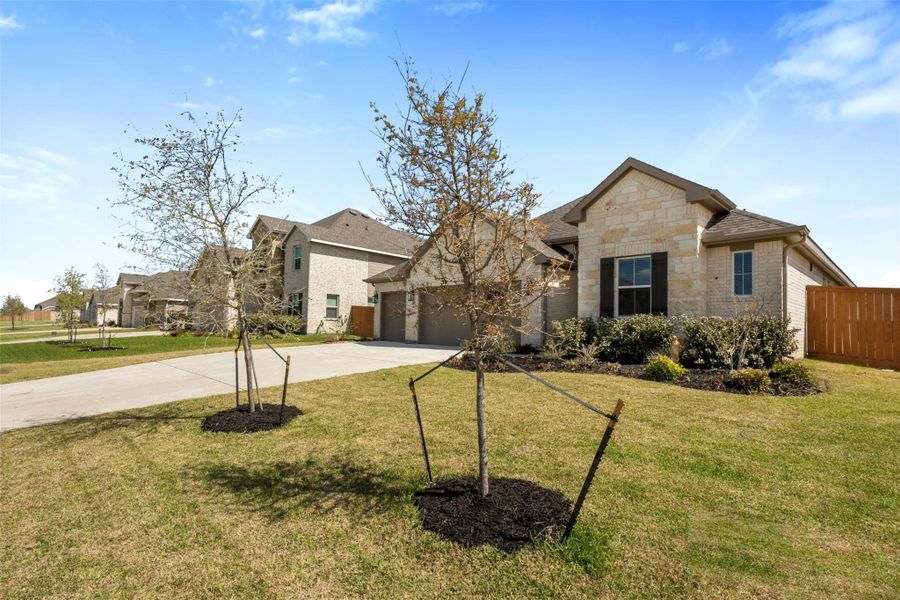 Front exterior of a new home in , Dayton, TX, highlighting curb appeal (Image 20).